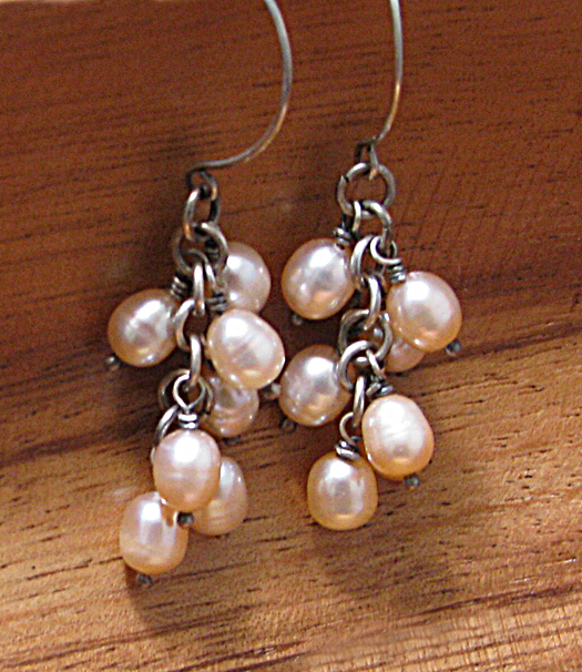 A cascade of pink freshwater pearls wrapped with sterling silver.